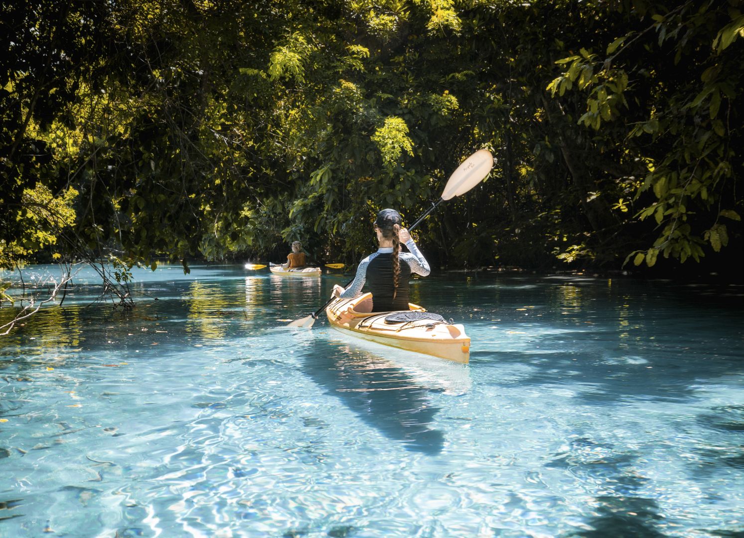 Kayaking on crystal clear calm waters in Port Vila, Efate